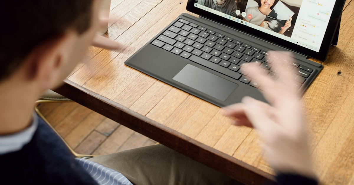 Remote sales rep in a home office on a coaching video call