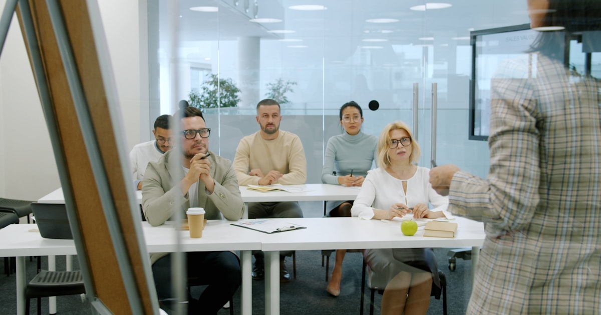 Sales rep on a call with an objection-handling prompt on screen